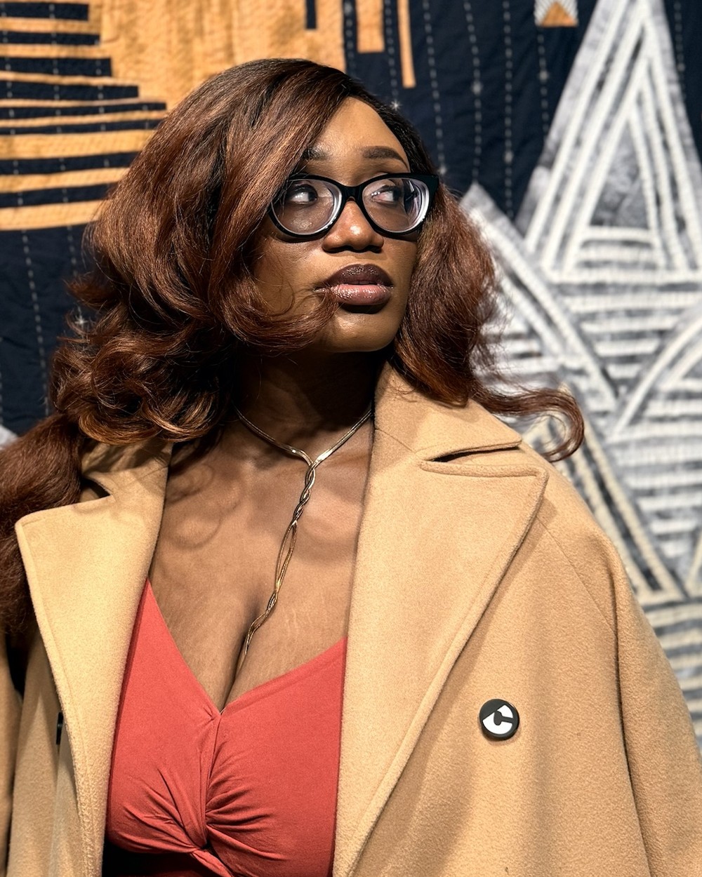 Ruova in a camel coat